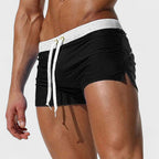 Men's mid-length swim shorts with drawstring waist in white and contrast trim