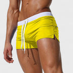 Men's mid-length swim shorts with drawstring waist in white and contrast trim