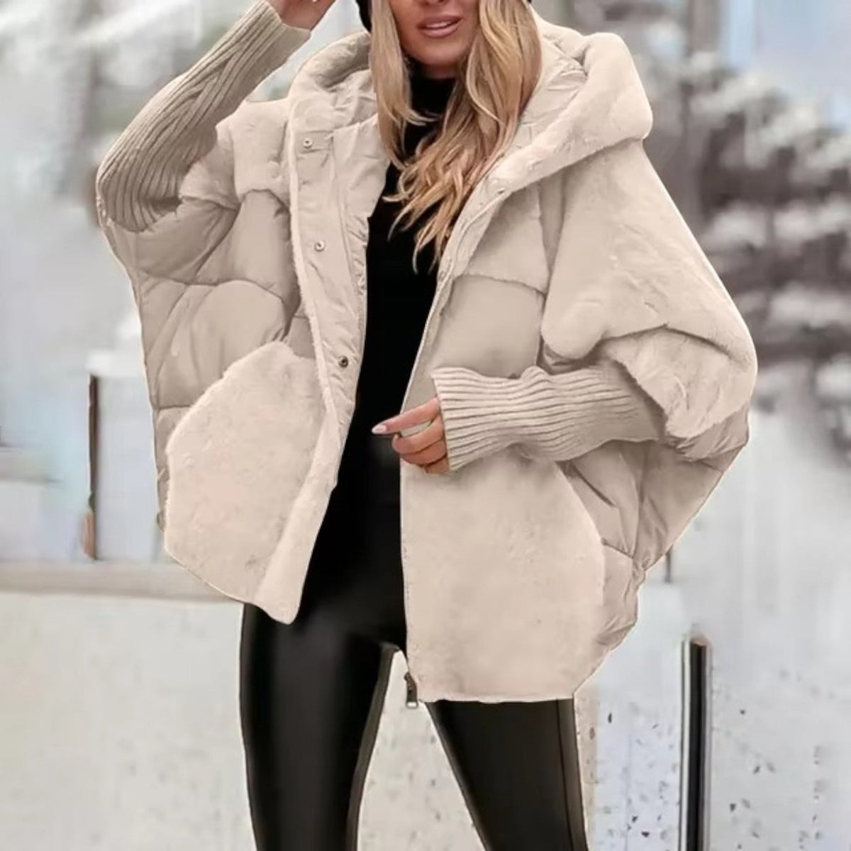 Women's oversized hooded quilted jacket with plush panels and ribbed cuffs