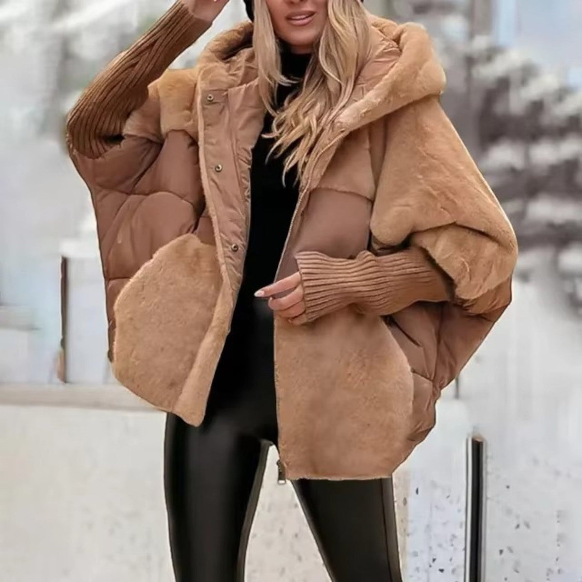 Women's oversized hooded quilted jacket with plush panels and ribbed cuffs