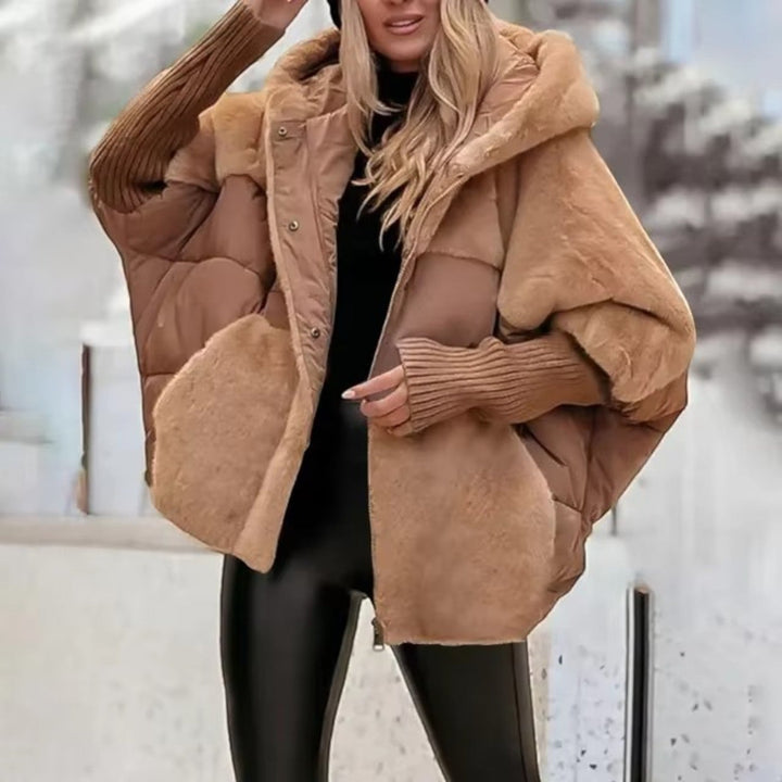 Women's oversized hooded quilted jacket with plush panels and ribbed cuffs