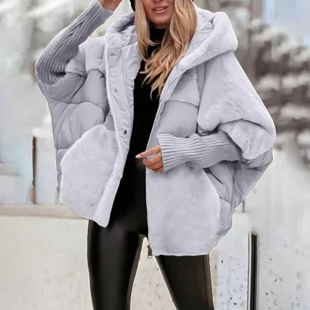 Women's oversized hooded quilted jacket with plush panels and ribbed cuffs