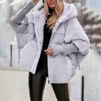 Women's oversized hooded quilted jacket with plush panels and ribbed cuffs