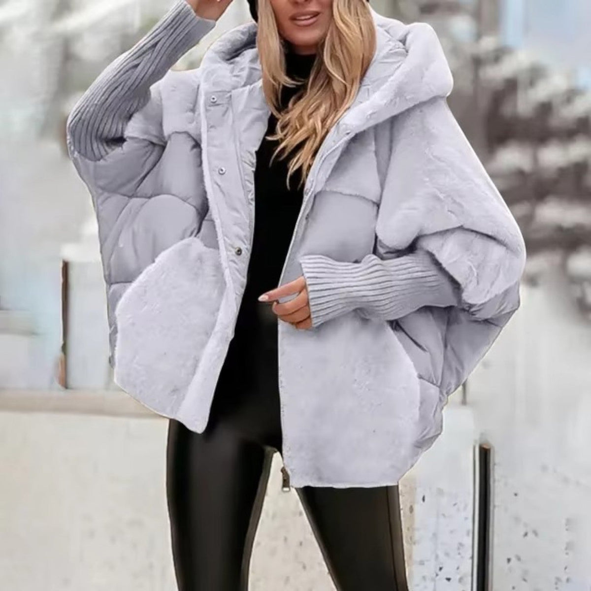 Women's oversized hooded quilted jacket with plush panels and ribbed cuffs