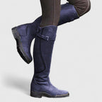 Tall winter boots with buckle straps and low heels