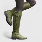 Tall winter boots with buckle straps and low heels