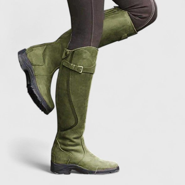 Tall winter boots with buckle straps and low heels
