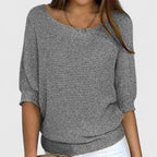 Women's textured knit pullover with round neckline and three-quarter sleeves