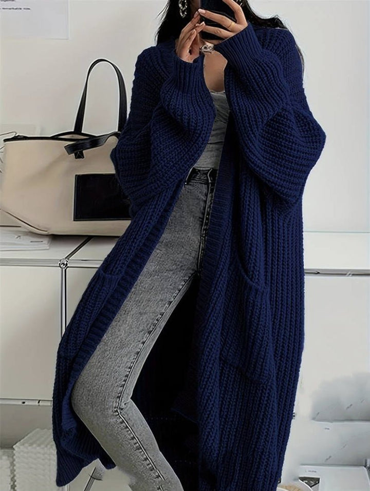 Women's long ribbed knit cardigan with open front, shawl collar and front pockets