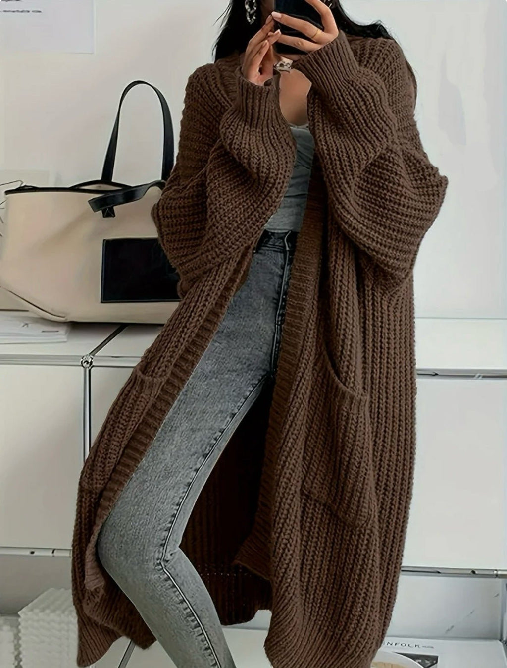 Women's long ribbed knit cardigan with open front, shawl collar and front pockets