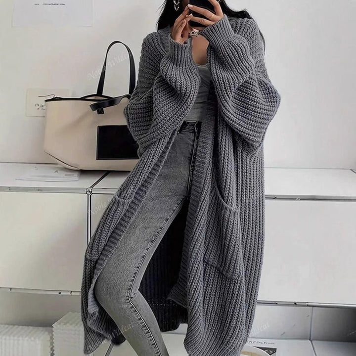 Women's long ribbed knit cardigan with open front, shawl collar and front pockets