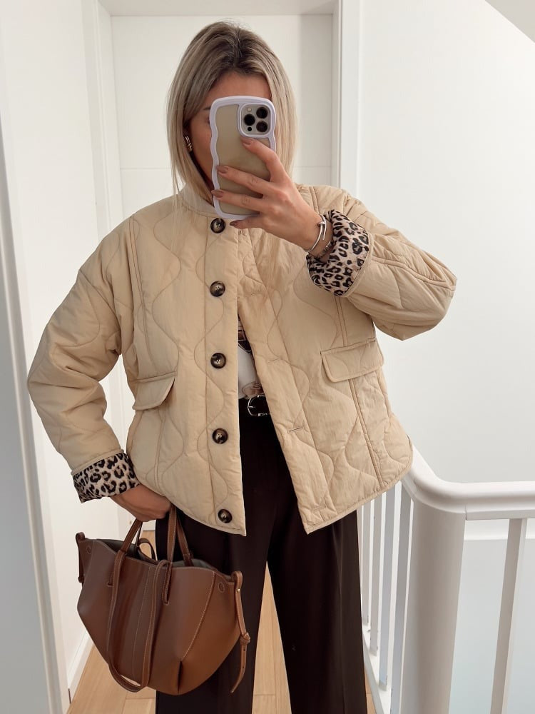 Women's quilted jacket with leopard-print cuffs and button front