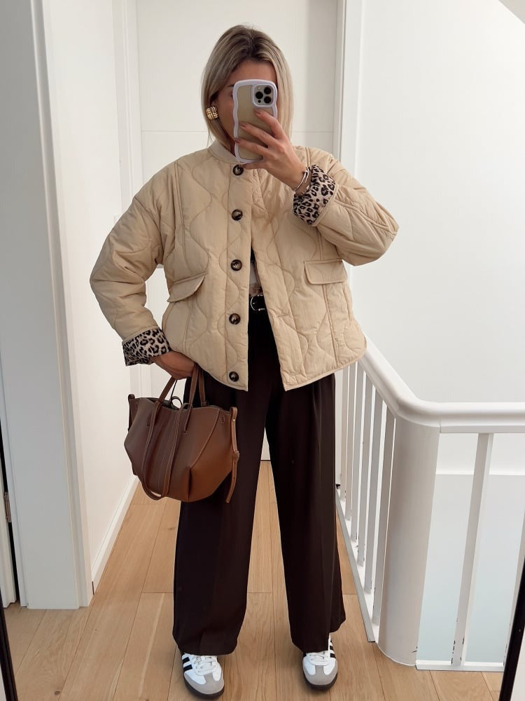 Women's quilted jacket with leopard-print cuffs and button front