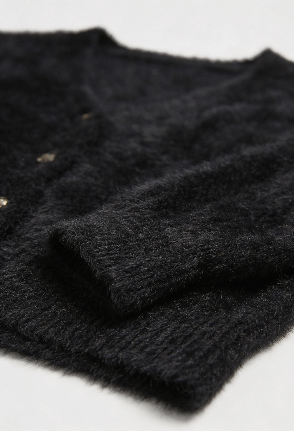 Women's black fuzzy cropped cardigan with V-neck and gold-tone buttons