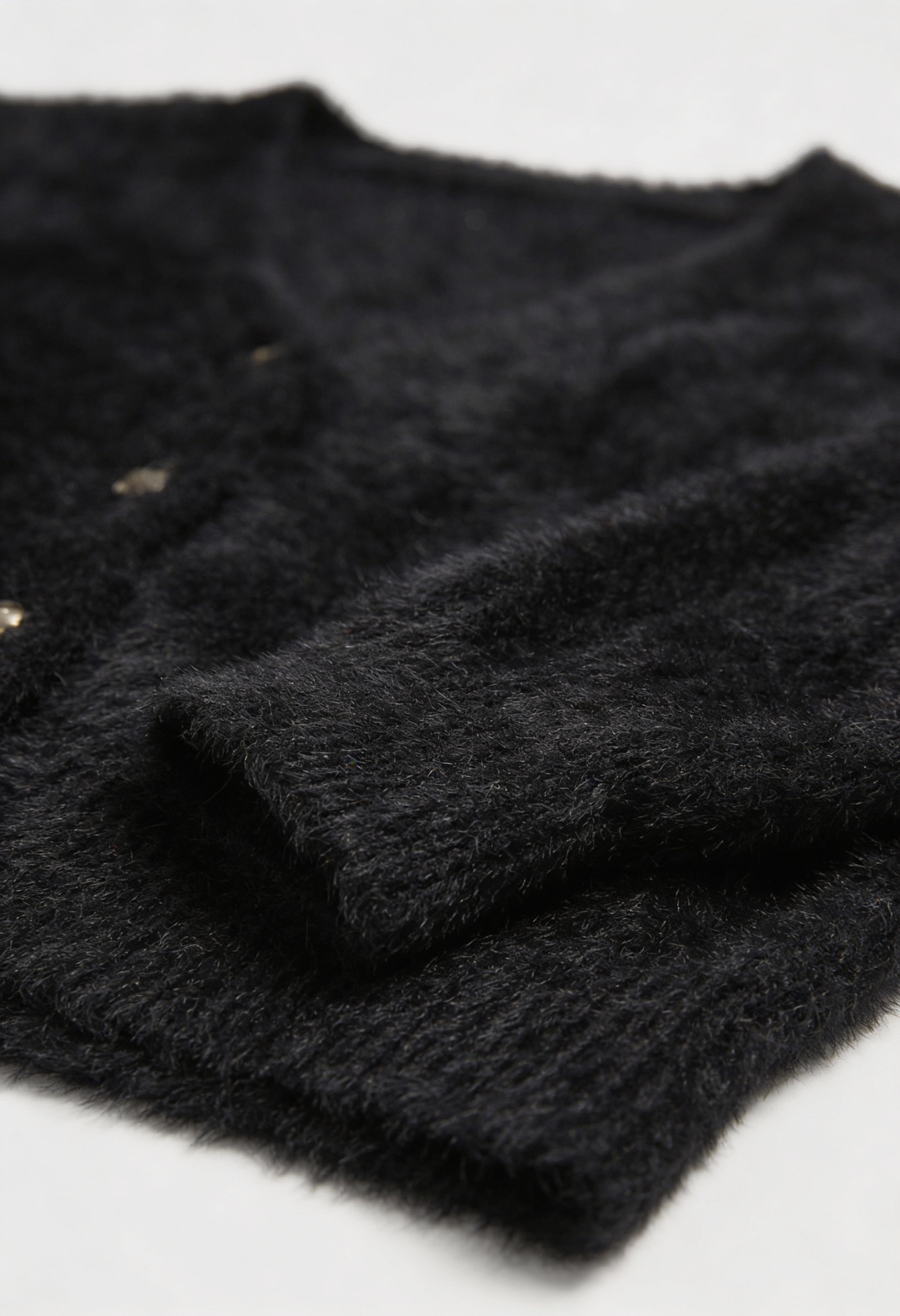 Women's black fuzzy cropped cardigan with V-neck and gold-tone buttons