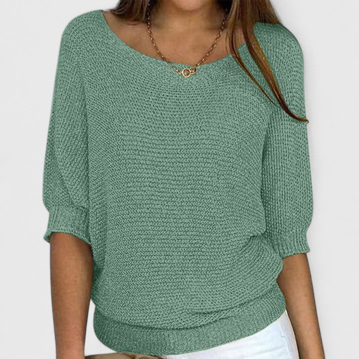 Women's textured knit pullover with round neckline and three-quarter sleeves