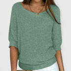 Women's textured knit pullover with round neckline and three-quarter sleeves