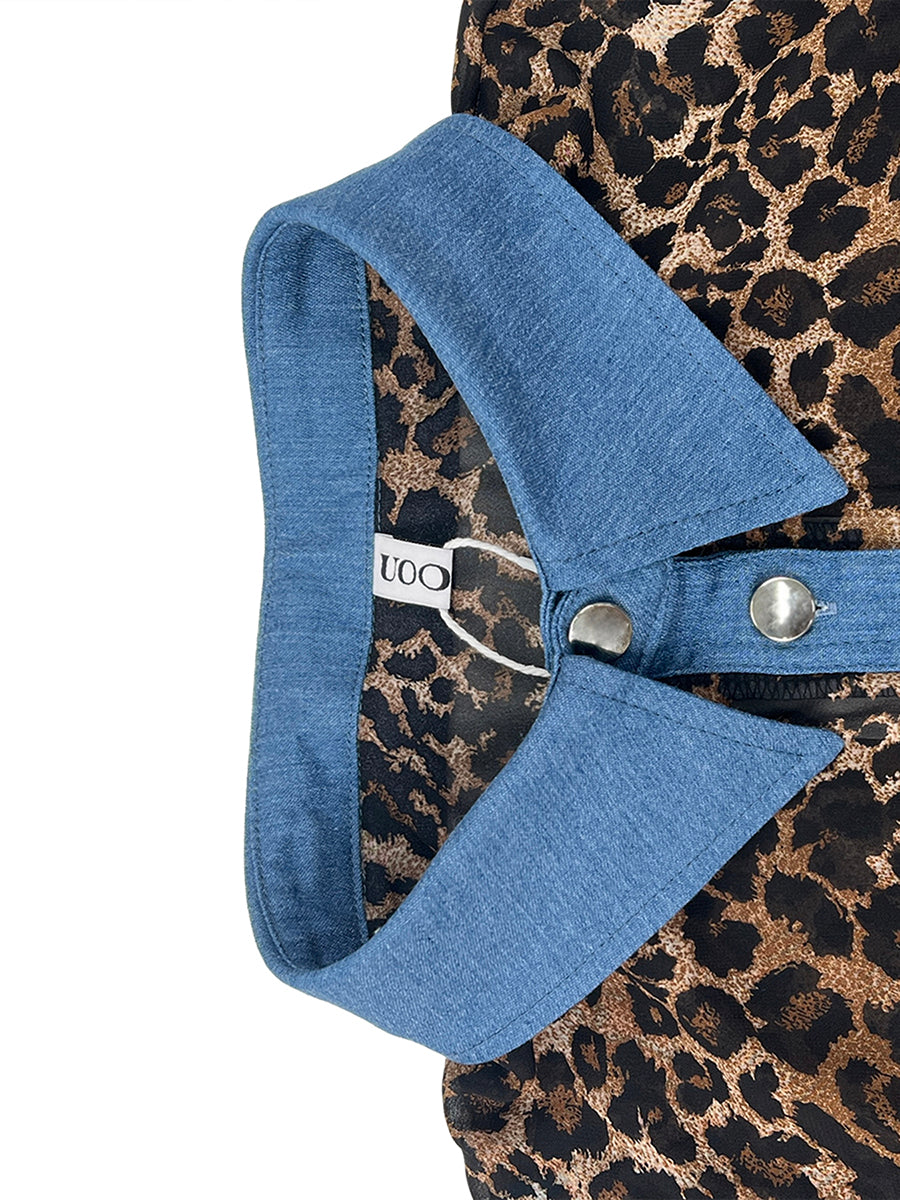 Women's leopard print blouse with blue contrast trim and long sleeves