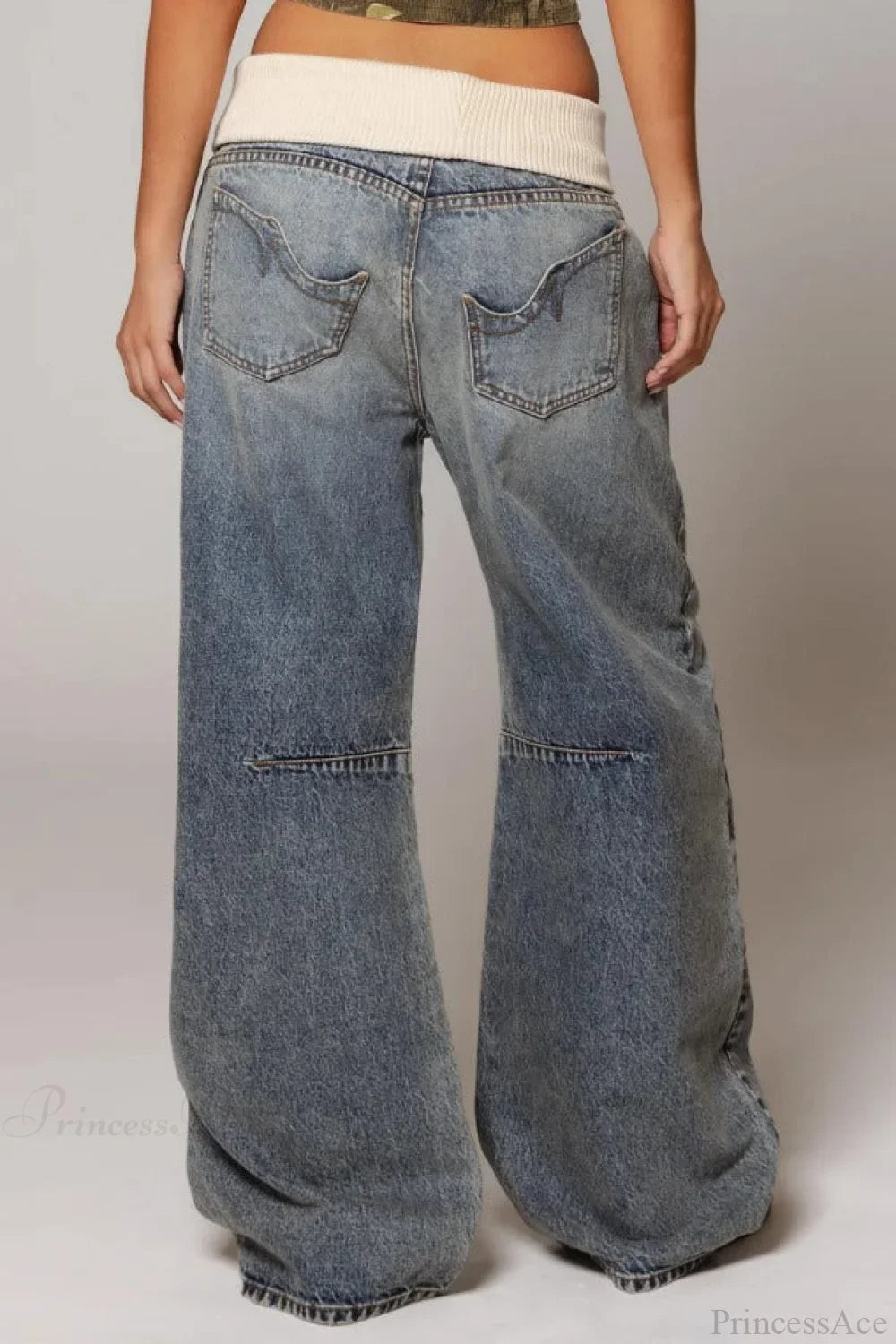 Women's washed blue wide-leg jeans with contrasting curved panel detailing