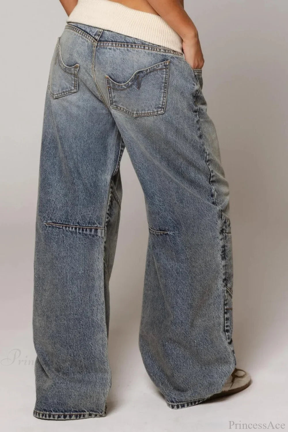 Women's washed blue wide-leg jeans with contrasting curved panel detailing