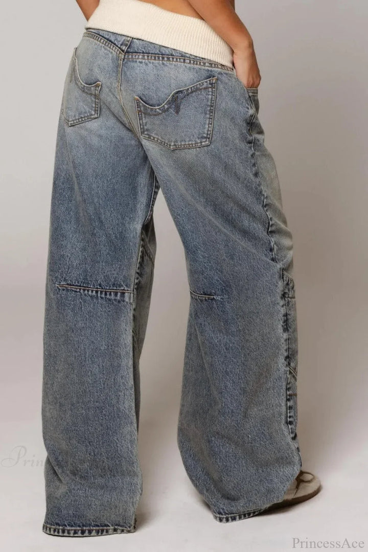 Women's washed blue wide-leg jeans with contrasting curved panel detailing