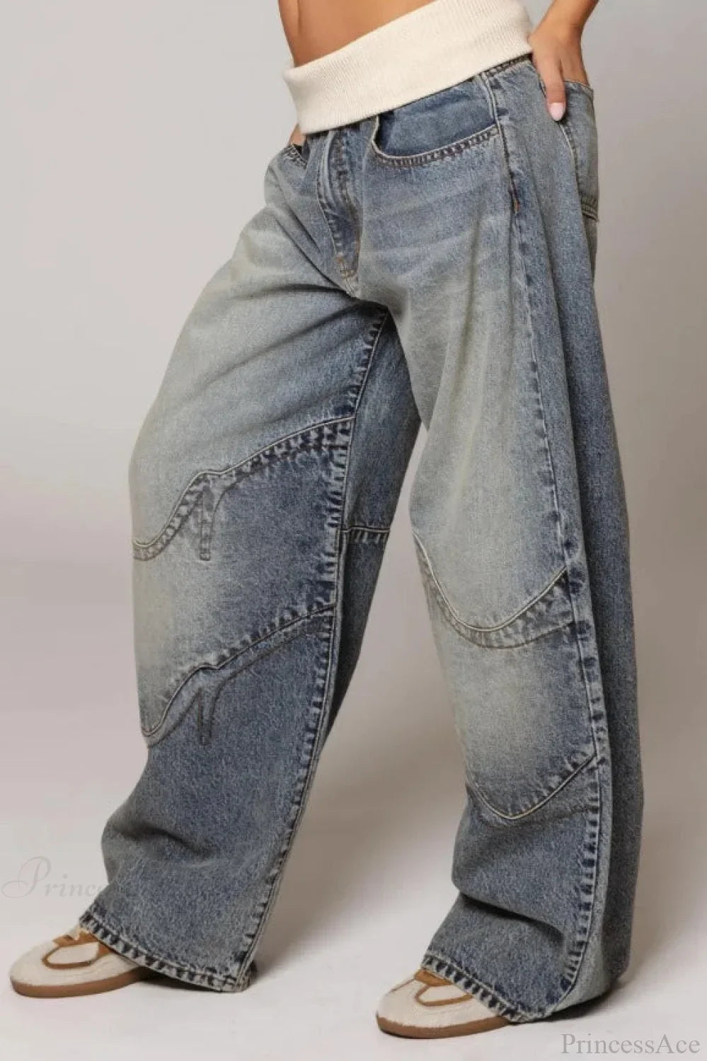 Women's washed blue wide-leg jeans with contrasting curved panel detailing