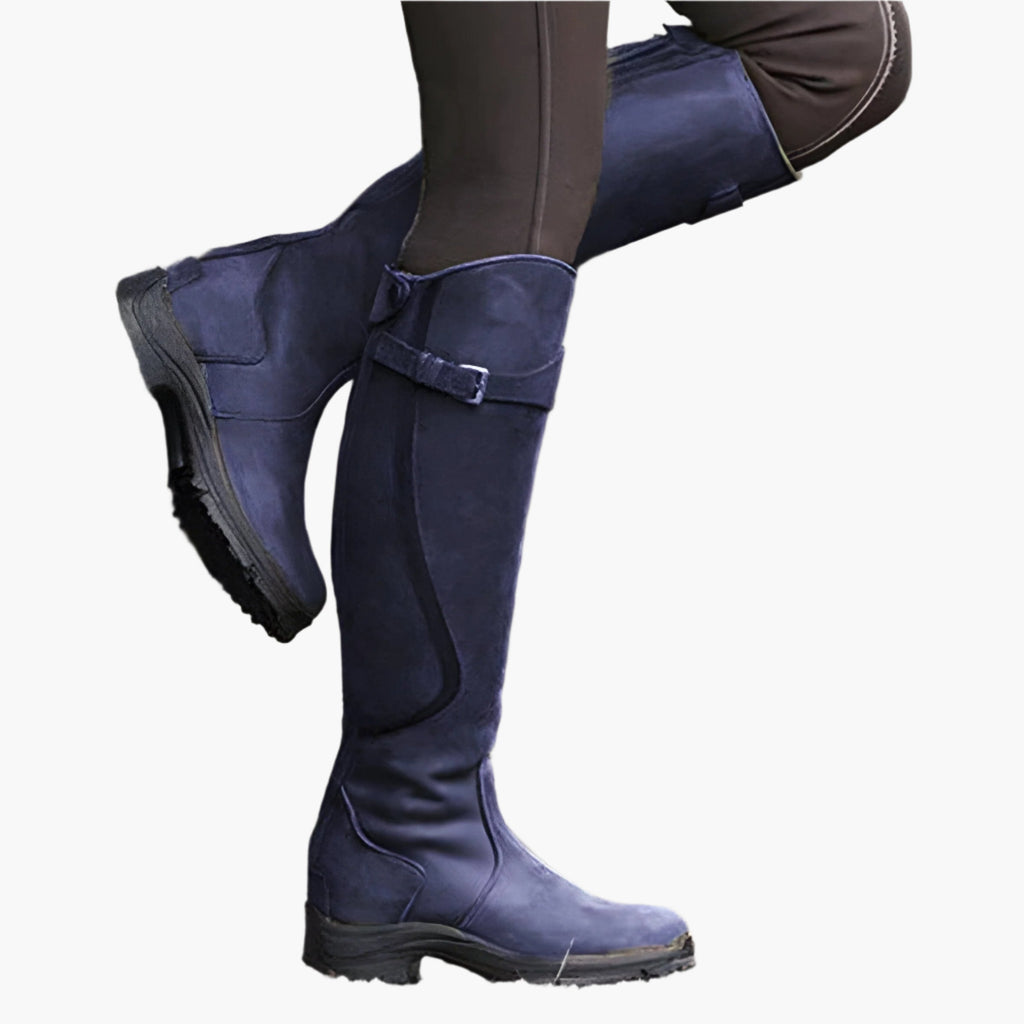 Women's tall riding boots with buckle straps, panelled shafts and flat textured soles