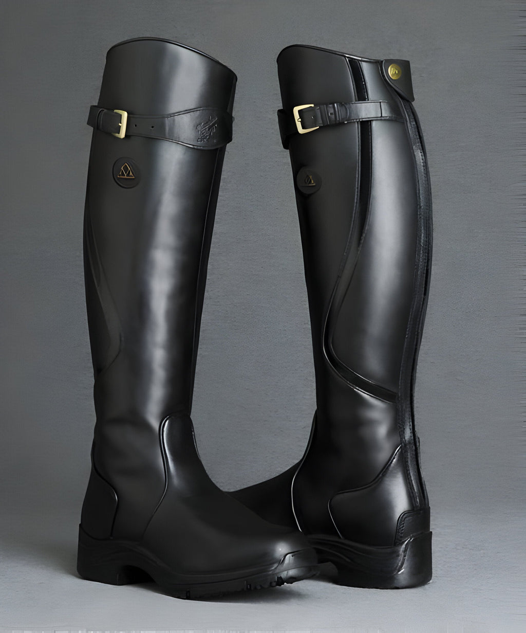 Women's tall riding boots with buckle straps, panelled shafts and flat textured soles