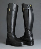 Women's tall riding boots with buckle straps, panelled shafts and flat textured soles