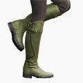 Women's tall riding boots with buckle straps, panelled shafts and flat textured soles