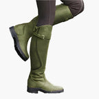 Women's tall riding boots with buckle straps, panelled shafts and flat textured soles