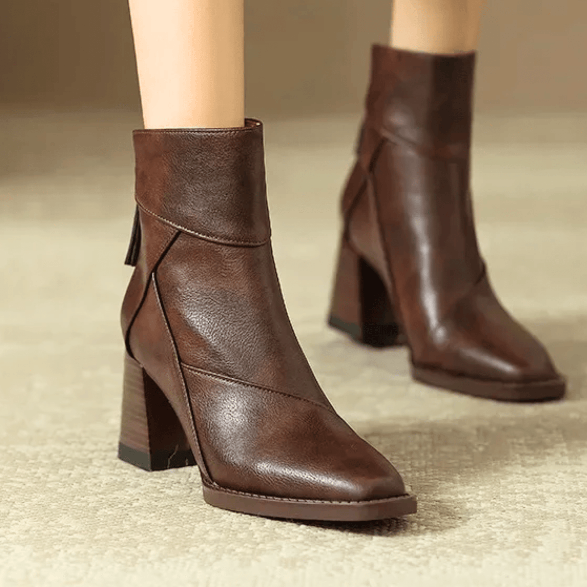 Women's pointed toe ankle boots with high block heel and hanging tassel detail