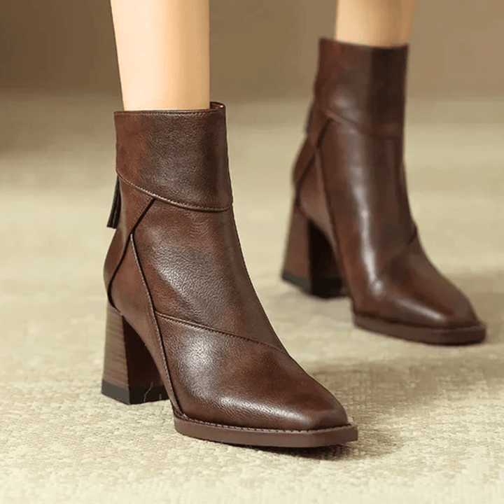 Women's pointed toe ankle boots with high block heel and hanging tassel detail