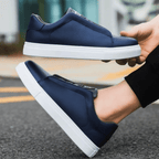 Unisex low-top panelled sneakers with lace-up front and flat sole
