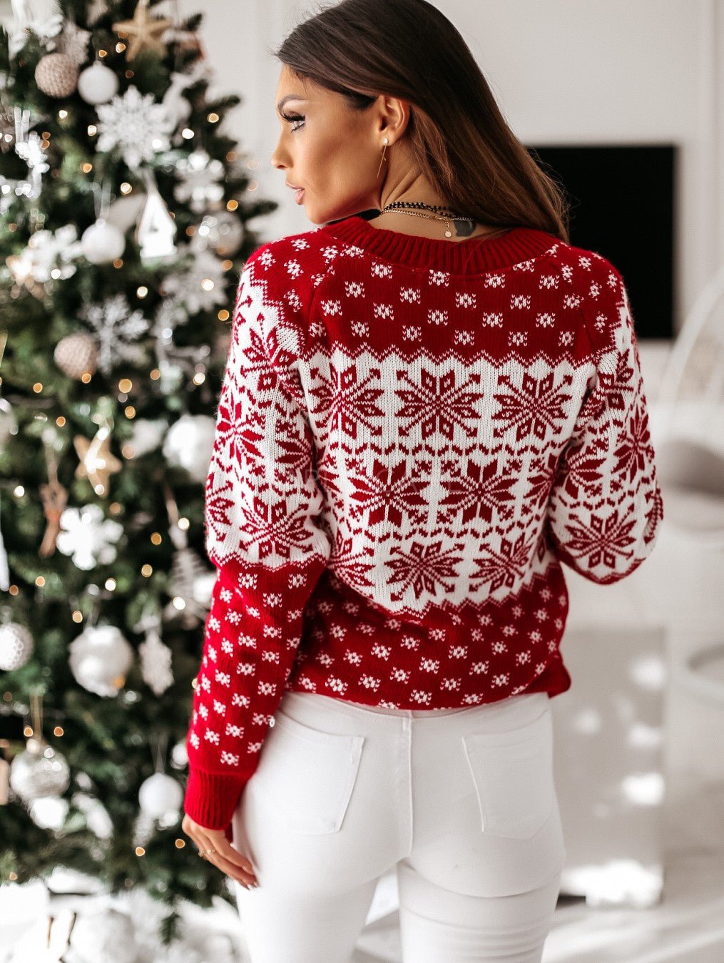 Women's red and white festive Fair Isle jumper with snowflake and reindeer motifs