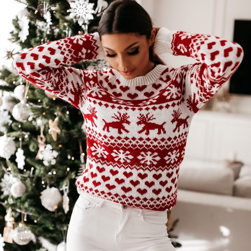 Women's red and white festive Fair Isle jumper with snowflake and reindeer motifs