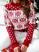 Women's red and white festive Fair Isle jumper with snowflake and reindeer motifs