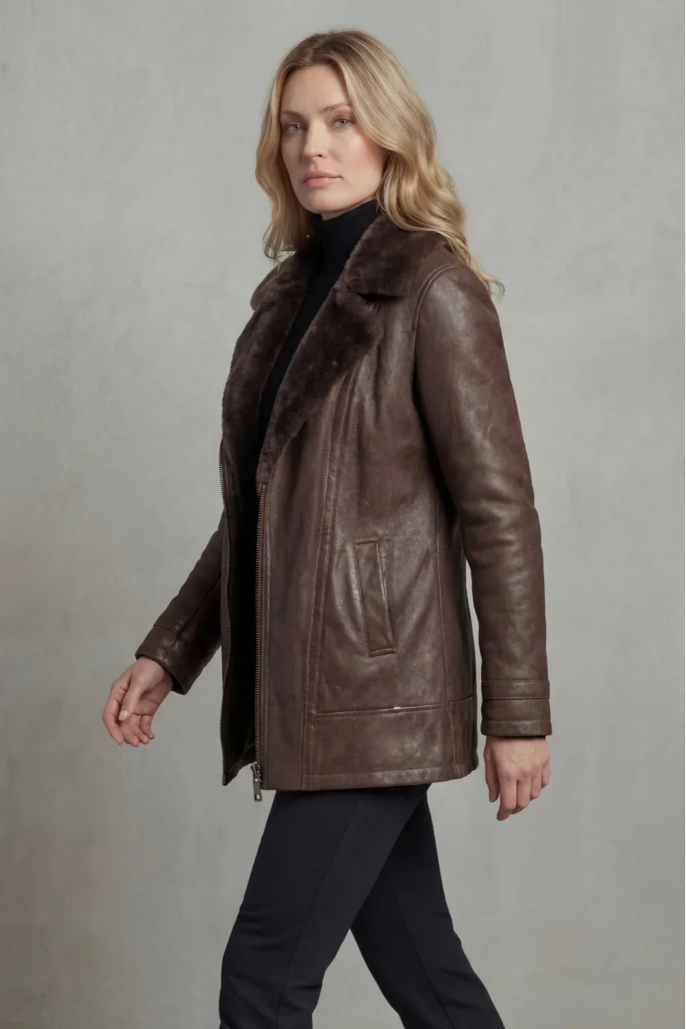 Women's brown shearling-lined jacket with wide dark collar and front zip