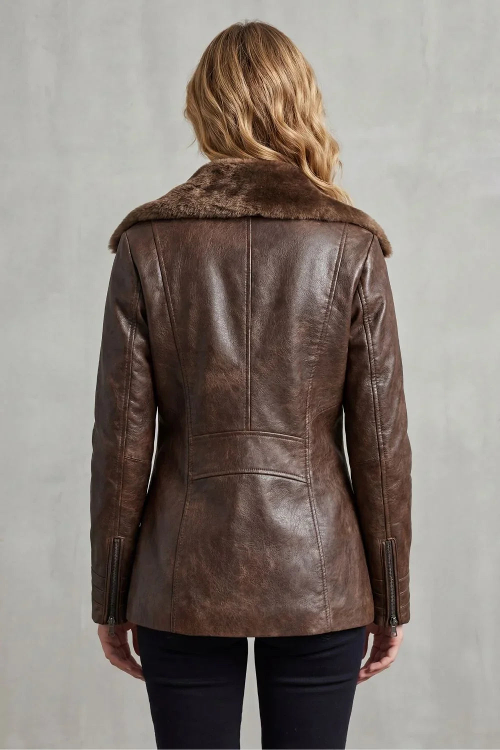 Women's brown shearling-lined jacket with wide dark collar and front zip