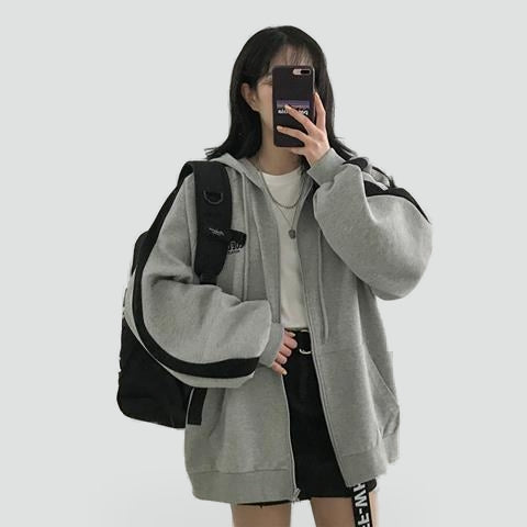 Women's relaxed hooded zip-front hoodie with long sleeves and front pockets