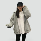 Women's relaxed hooded zip-front hoodie with long sleeves and front pockets