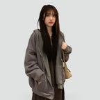 Women's relaxed hooded zip-front hoodie with long sleeves and front pockets