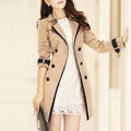 Women's long double-breasted trench coat with collared neckline and cuff tabs