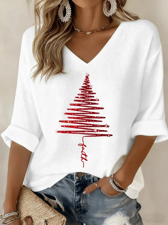 Women's white V-neck knit top with a red Christmas tree graphic