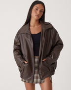 Women's oversized bomber jacket with collared neckline, zip front and elasticated hem