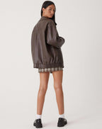 Women's oversized bomber jacket with collared neckline, zip front and elasticated hem