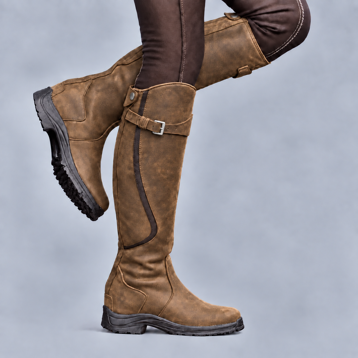 Women's tall riding boots with buckle strap, side zip and rugged tread sole