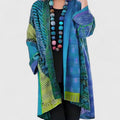 Women's open-front patchwork longline cardigan with patterned panels and long sleeves