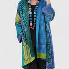 Women's open-front patchwork longline cardigan with patterned panels and long sleeves