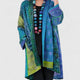 Women's open-front patchwork longline cardigan with patterned panels and long sleeves